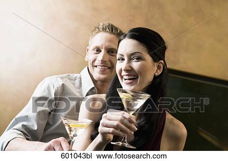 portrait of young couple in bar with cocktail glasses View Large Photo Image Stock Image - portrait of young couple in bar with cocktail glasses. Fotosearch