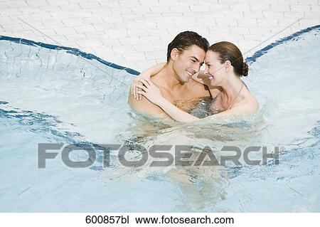 portrait of young couple in swimming pool View Large Photo Image Stock Image - portrait of young couple in swimming pool. Fotosearch