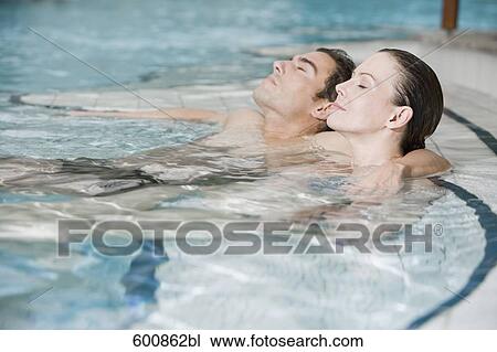 portrait of young couple in swimming pool View Large Photo Image Stock Image - portrait of young couple in swimming pool. Fotosearch