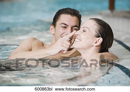 portrait of young couple in swimming pool View Large Photo Image Stock Image - portrait of young couple in swimming pool. Fotosearch