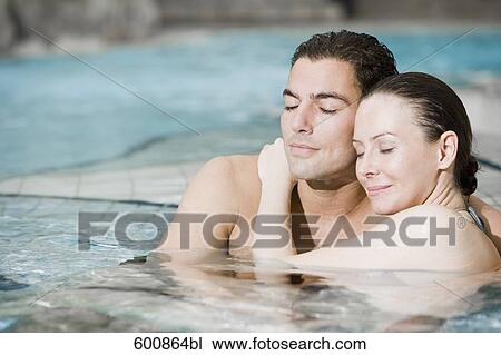portrait of young couple in swimming pool View Large Photo Image Stock Image - portrait of young couple in swimming pool. Fotosearch