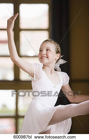 portrait of young girl exercising on ballet barre View Large Photo Image Stock Image - portrait of young girl exercising on ballet barre. Fotosearch
