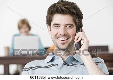 portrait of young man at home talking on the telephone View Large Photo Image Stock Image - portrait of young man at home talking on the telephone. Fotosearch