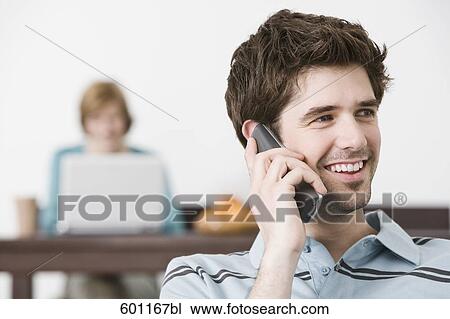 portrait of young man at home talking on the telephone View Large Photo Image Stock Image - portrait of young man at home talking on the telephone. Fotosearch