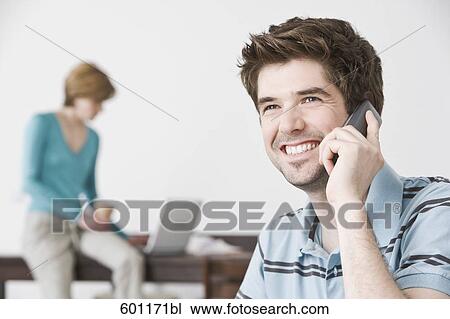 portrait of young man at home talking on the telephone View Large Photo Image Stock Image - portrait of young man at home talking on the telephone. Fotosearch