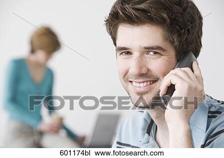 portrait of young man at home talking on the telephone View Large Photo Image Stock Image - portrait of young man at home talking on the telephone. Fotosearch