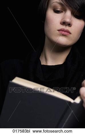 portrait of young woman reading book View Large Photo Image Stock Image - portrait of young woman reading book. Fotosearch