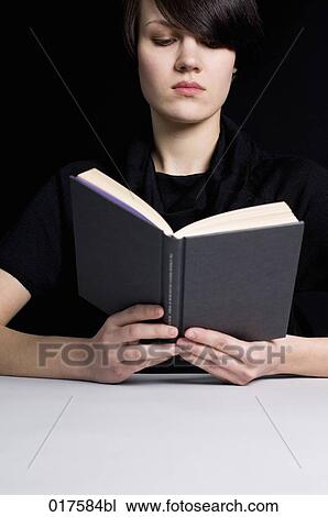 portrait of young woman reading book View Large Photo Image Stock Image - portrait of young woman reading book. Fotosearch