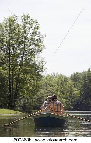 rear view of couple embracing in rowing boat View Large Photo Image Stock Image - rear view of couple embracing in rowing boat. Fotosearch