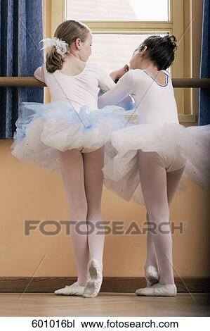 rear view of two young dancers standing at ballet barre View Large Photo Image Stock Image - rear view of two young dancers standing at ballet barre. Fotosearch