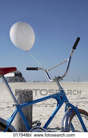 still life of bicycle with white balloon on beach View Large Photo Image Stock Image - still life of bicycle with white balloon on beach. Fotosearch