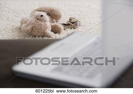 still life of teddy bear with laptop computer in foreground View Large Photo Image Stock Image - still life of teddy bear with laptop computer in foreground. Fotosearch