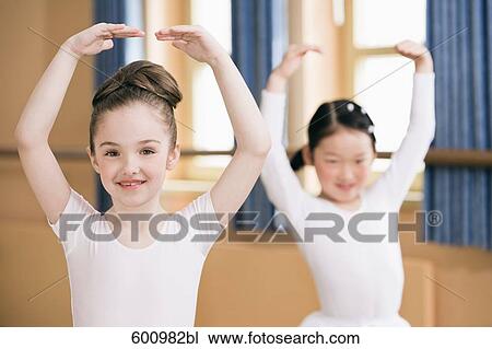 tow young girls dancing ballet View Large Photo Image Stock Image - tow young girls dancing ballet. Fotosearch