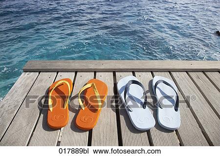 two pairs of flip flops on pier View Large Photo Image Stock Image - two pairs of flip flops on pier. Fotosearch