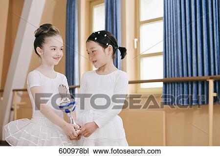 two young ballet dancers holding trophy View Large Photo Image Stock Image - two young ballet dancers holding trophy. Fotosearch