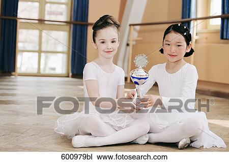two young ballet dancers holding trophy View Large Photo Image Stock Image - two young ballet dancers holding trophy. Fotosearch