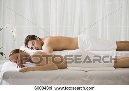 woman and man lying on massage benches View Large Photo Image Stock Image - woman and man lying on massage benches. Fotosearch