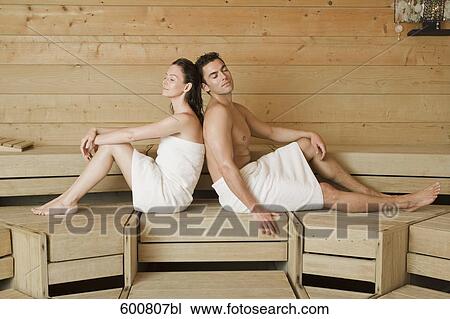 woman and man relaxing in sauna sitting back to back View Large Photo Image Stock Image - woman and man relaxing in sauna sitting back to back. Fotosearch