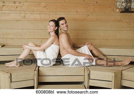 woman and man relaxing in sauna sitting back to back View Large Photo Image Stock Image - woman and man relaxing in sauna sitting back to back. Fotosearch
