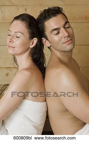 woman and man relaxing in sauna sitting back to back View Large Photo Image Stock Image - woman and man relaxing in sauna sitting back to back. Fotosearch