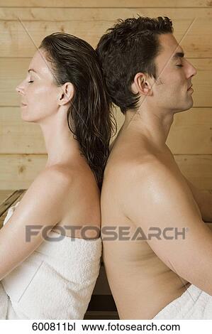 woman and man relaxing in sauna sitting back to back View Large Photo Image Stock Image - woman and man relaxing in sauna sitting back to back. Fotosearch