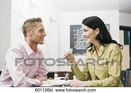 young couple at cafe flirting with each other View Large Photo Image Stock Image - young couple at cafe flirting with each other. Fotosearch