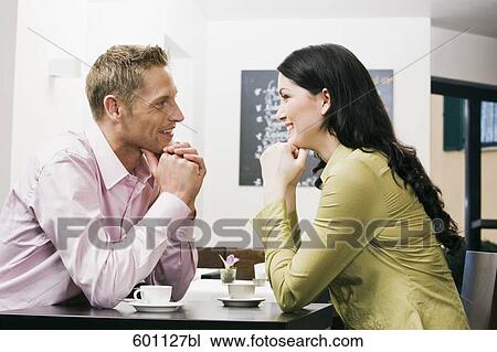 young couple at cafe flirting with each other View Large Photo Image Stock Image - young couple at cafe flirting with each other. Fotosearch