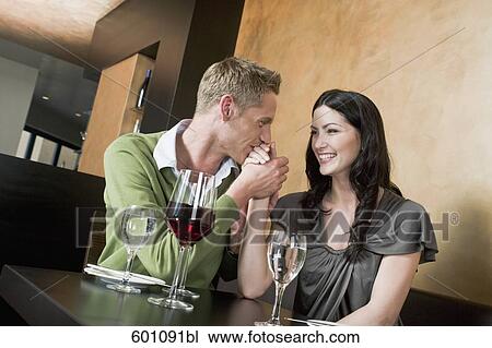 young couple at restaurant holding hands View Large Photo Image Stock Image - young couple at restaurant holding hands. Fotosearch