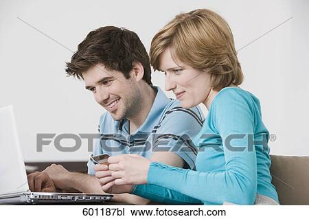 young couple in front of laptop computer with credit card View Large Photo Image Stock Image - young couple in front of laptop computer with credit card. Fotosearch