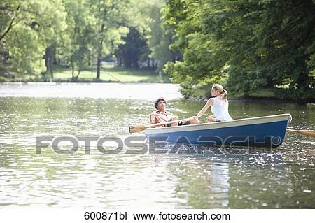 young couple in rowing boat on lake View Large Photo Image Stock Image - young couple in rowing boat on lake. Fotosearch
