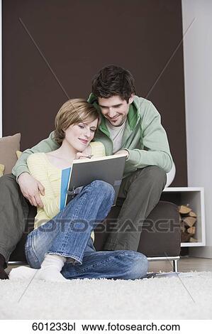 young couple reading documents at home together View Large Photo Image Stock Image - young couple reading documents at home together. Fotosearch