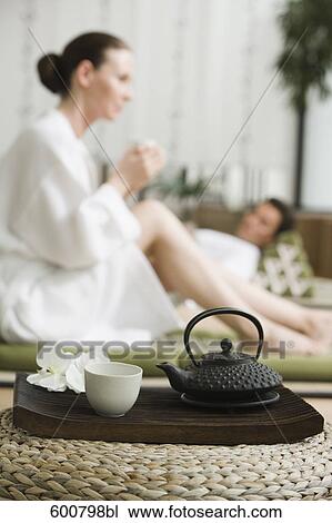 young couple relaxing and drinking tea View Large Photo Image Stock Image - young couple relaxing and drinking tea. Fotosearch