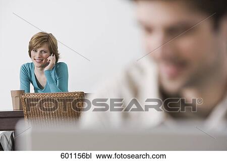 young woman at home talking on the telephone View Large Photo Image Stock Image - young woman at home talking on the telephone. Fotosearch