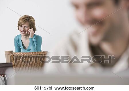 young woman at home talking on the telephone View Large Photo Image Stock Image - young woman at home talking on the telephone. Fotosearch