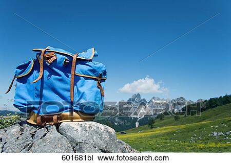 blue rucksack on rock in front of mountains View Large Photo Image Stock Image - blue rucksack on rock in front of mountains. Fotosearch