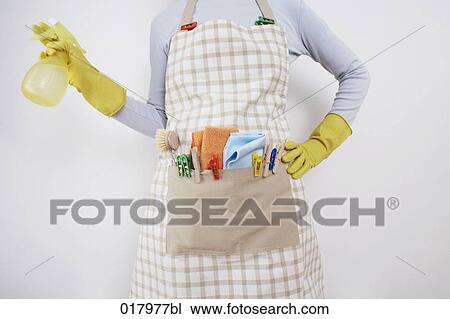 detail of woman ready to do housework holding spray bottle View Large Photo Image Stock Image - detail of woman ready to do housework holding spray bottle. Fotosearch
