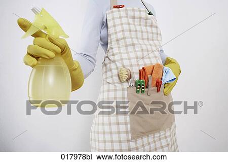 detail of woman ready to do housework holding spray bottle View Large Photo Image Stock Image - detail of woman ready to do housework holding spray bottle. Fotosearch