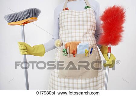 detail of woman ready to do housework holding broom and feather duster View Large Photo Image Stock Image - detail of woman ready to do housework holding broom and feather duster. Fotosearch