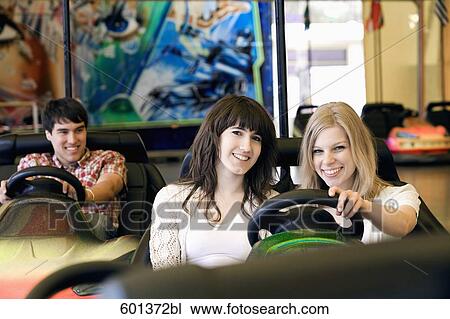 group of three teenagers sitting in bumper cars View Large Photo Image Stock Image - group of three teenagers sitting in bumper cars. Fotosearch