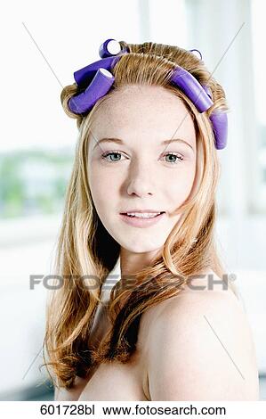 headshot of young woman with curlers in her hair View Large Photo Image Stock Image - headshot of young woman with curlers in her hair. Fotosearch