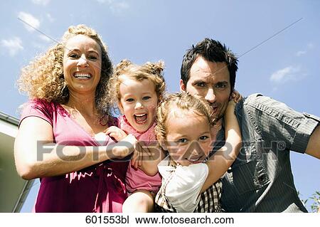 low angle portrait of family with two children View Large Photo Image Stock Image - low angle portrait of family with two children. Fotosearch