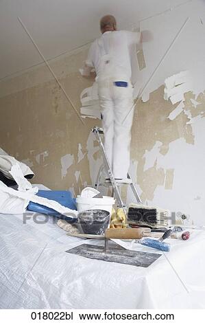 man redecorating walls in empty flat View Large Photo Image Stock Image - man redecorating walls in empty flat. Fotosearch