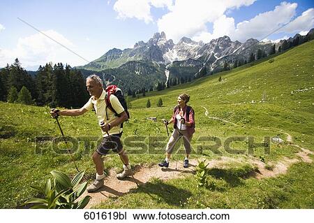 mature couple doing nordic walking in the mountains View Large Photo Image Stock Image - mature couple doing nordic walking in the mountains. Fotosearch