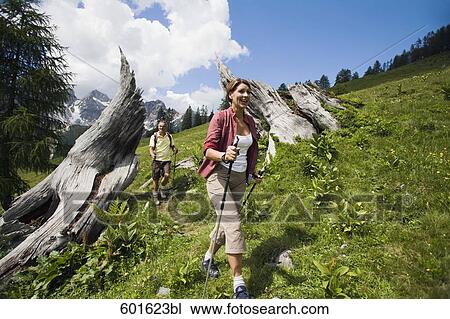 mature couple doing nordic walking in the mountains View Large Photo Image Stock Image - mature couple doing nordic walking in the mountains. Fotosearch