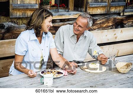 mature couple having meal in front of alpine hut View Large Photo Image Stock Image - mature couple having meal in front of alpine hut. Fotosearch