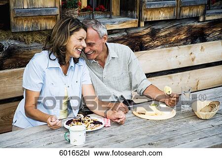 mature couple having meal in front of alpine hut View Large Photo Image Stock Image - mature couple having meal in front of alpine hut. Fotosearch