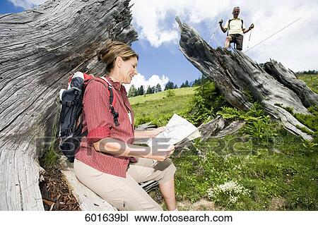 mature couple hiking in the mountains looking at map View Large Photo Image Stock Image - mature couple hiking in the mountains looking at map. Fotosearch