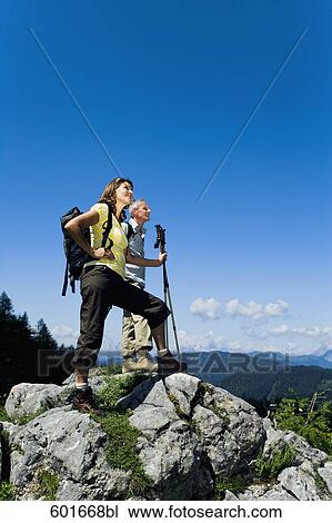 mature couple standing on rock in the mountains View Large Photo Image Stock Image - mature couple standing on rock in the mountains. Fotosearch