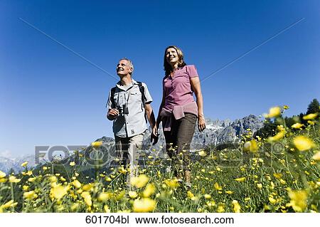 mature couple walking in the mountains View Large Photo Image Stock Image - mature couple walking in the mountains. Fotosearch