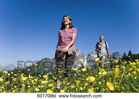 mature couple walking in the mountains View Large Photo Image Stock Image - mature couple walking in the mountains. Fotosearch